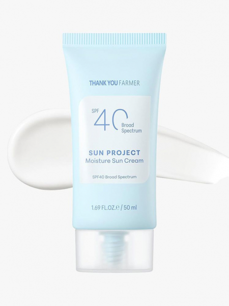 A blue tube of Thank You Farmer Sun Project Moisture Sun Cream SPF 40 and white product swatch on a light gray background