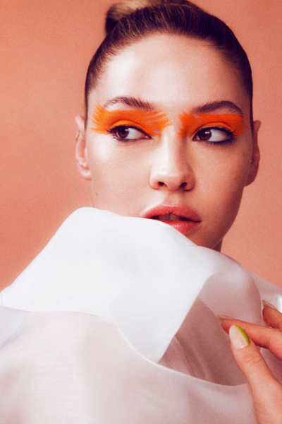 Madelyn Cline portrait with orange eye makeup