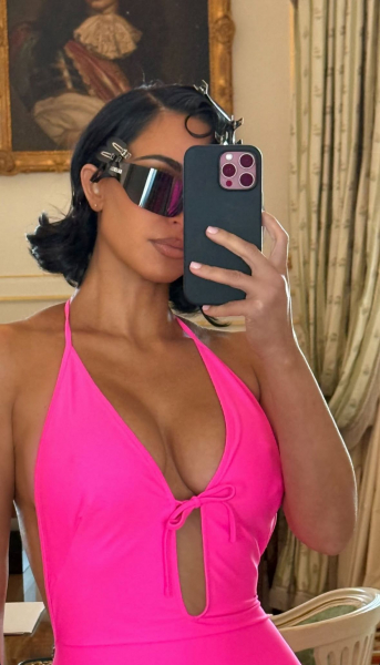 Kim Kardashian wearing a hot pink Balenciaga ensemble