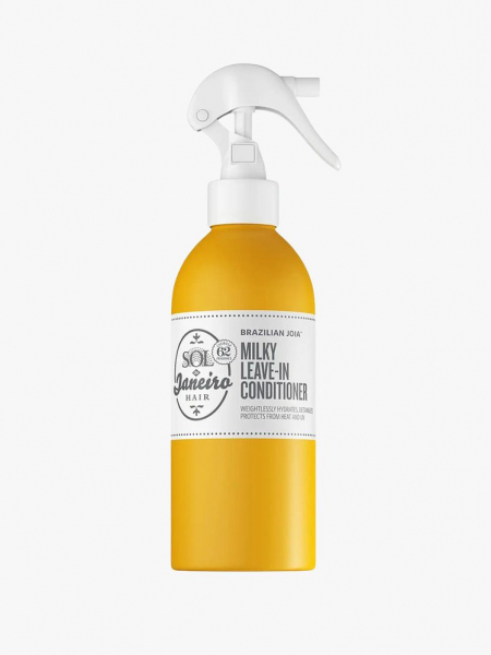 Sol de Janeiro Brazilian Joia Milky Leave-In Conditioner yellow bottle with white label and spray top on light grey background